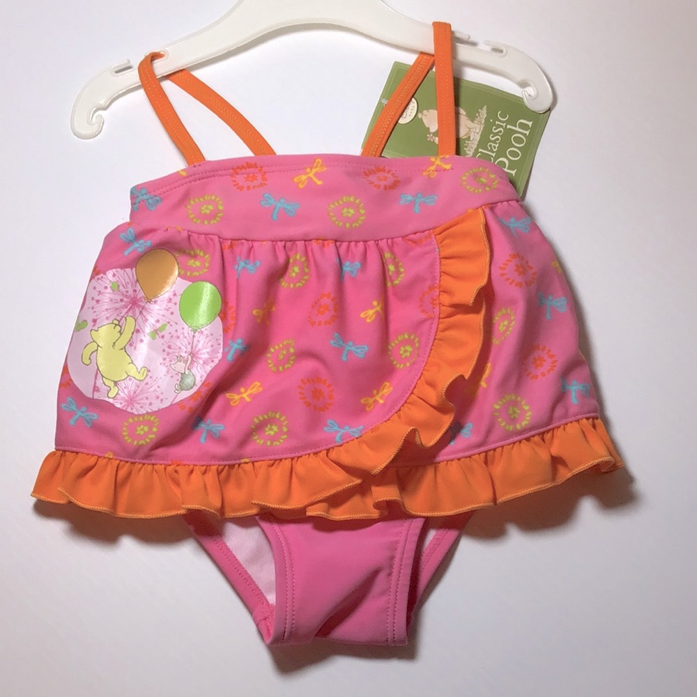 Pink Winnie the Pooh and Piglet pink Disney baby swimsuit with orange frills